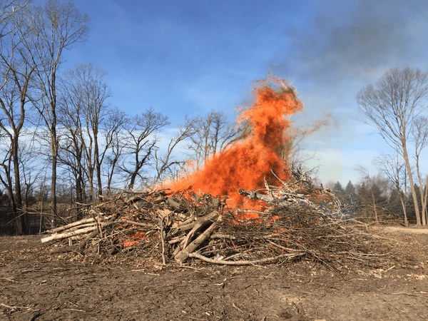 Brush pile being burned in an open field